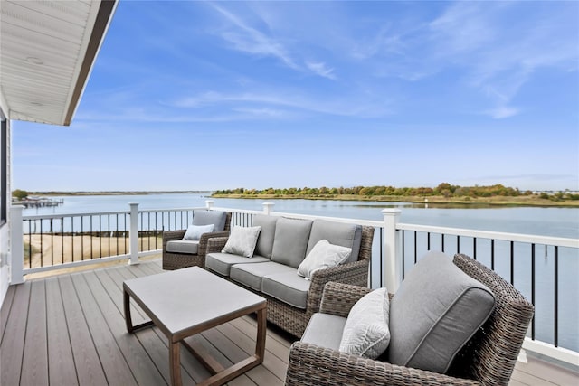 deck featuring an outdoor hangout area and a water view