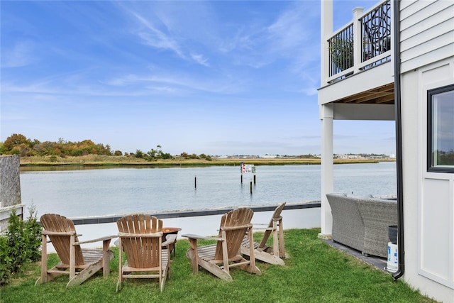 exterior space with a water view and a balcony