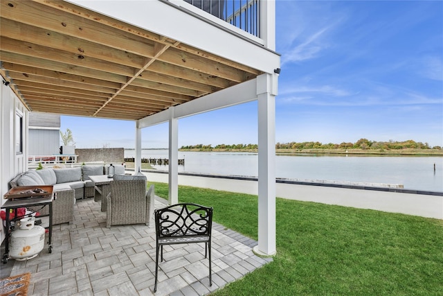 view of patio with a water view, an outdoor hangout area, and a balcony