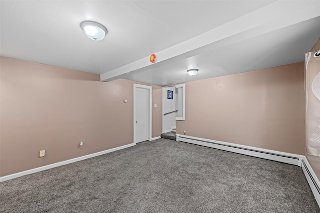 basement featuring carpet floors and a baseboard heating unit