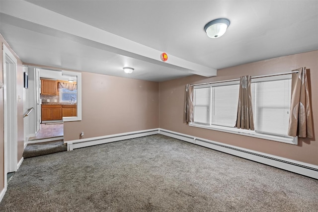 empty room with carpet, beamed ceiling, and baseboard heating