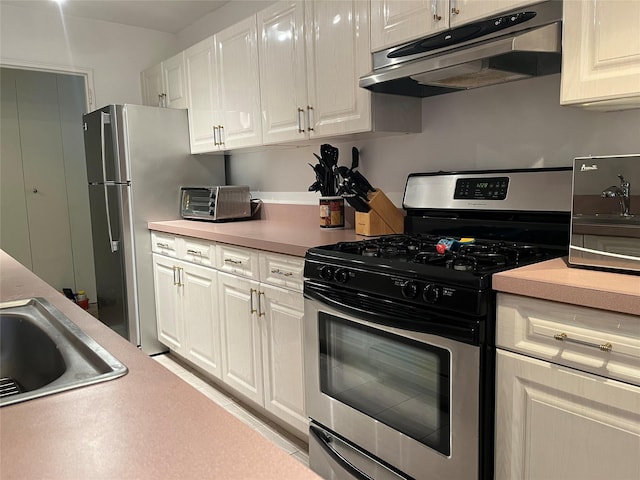 kitchen with white cabinetry, sink, and stainless steel appliances