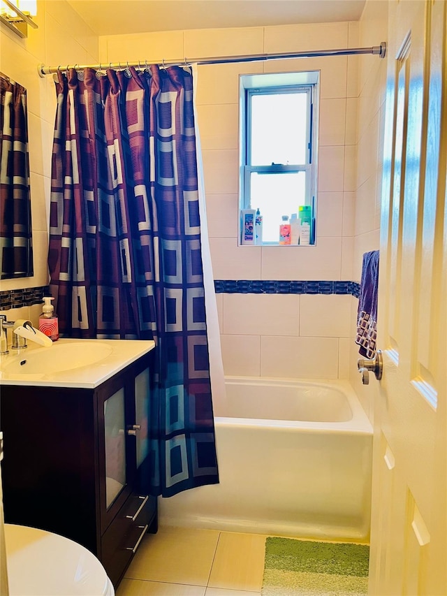 full bathroom with tile patterned floors, shower / bath combination with curtain, toilet, and vanity