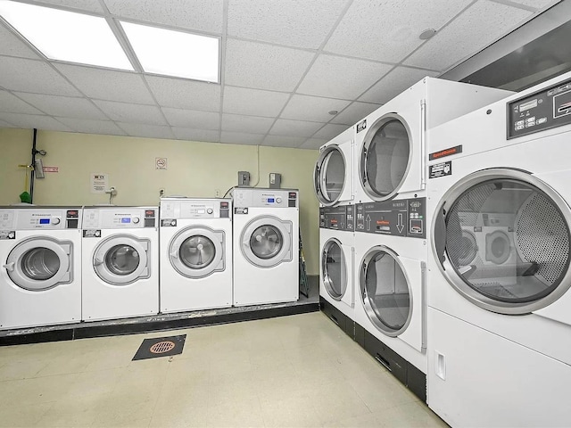 washroom featuring washing machine and dryer and stacked washing maching and dryer