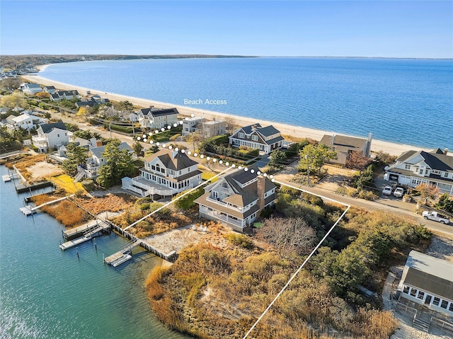 aerial view featuring a water view and a beach view