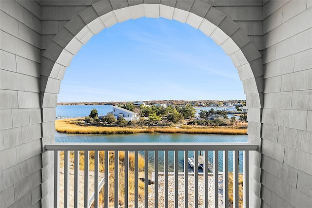 balcony featuring a water view