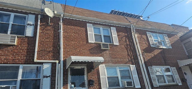 view of side of property featuring cooling unit