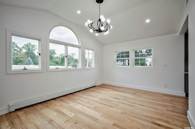 spare room featuring an inviting chandelier, light wood-type flooring, lofted ceiling, and a baseboard heating unit