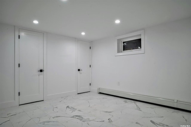 empty room featuring a baseboard radiator