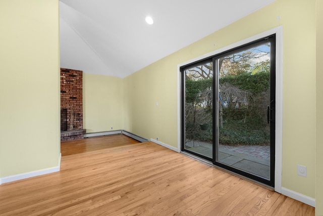 unfurnished living room with a fireplace and light hardwood / wood-style flooring