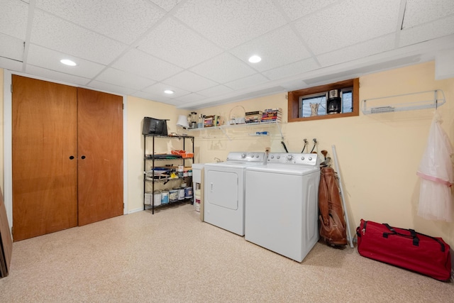 laundry area featuring washer and dryer and light colored carpet