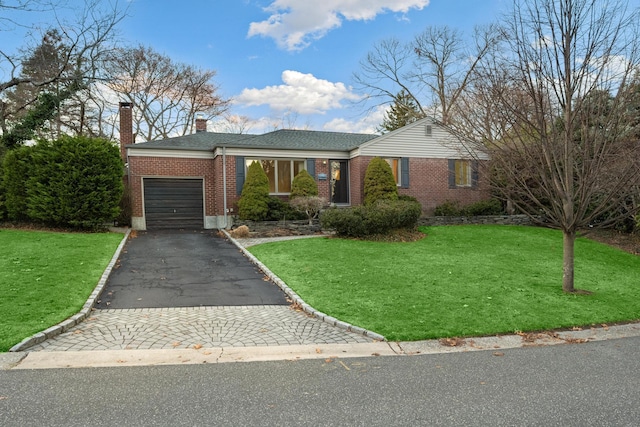 ranch-style home with a garage and a front yard