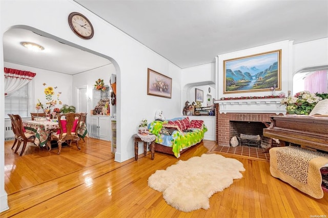 living area featuring hardwood / wood-style floors and a fireplace