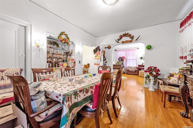 dining space with hardwood / wood-style flooring