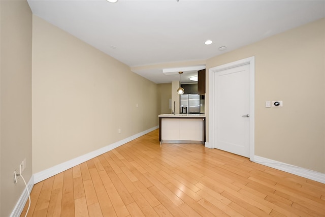 empty room featuring light hardwood / wood-style floors