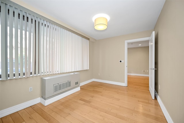 spare room featuring light hardwood / wood-style flooring