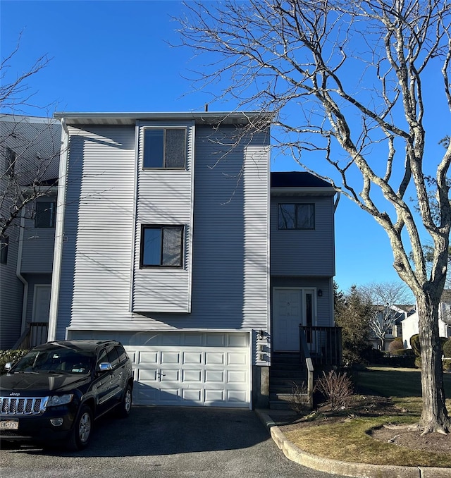 view of side of property with a garage