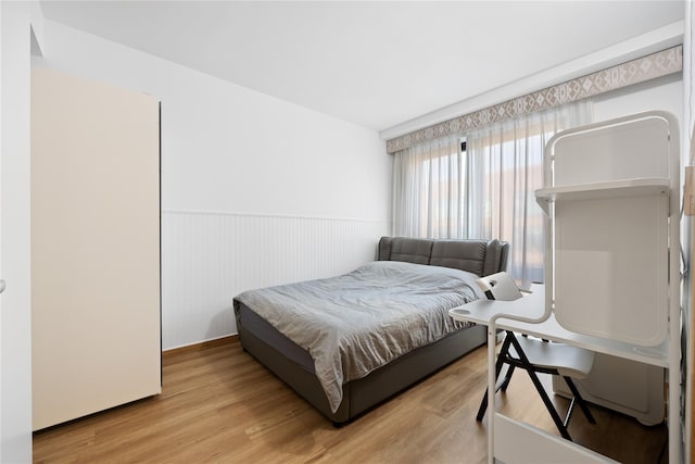 bedroom with light wood-type flooring