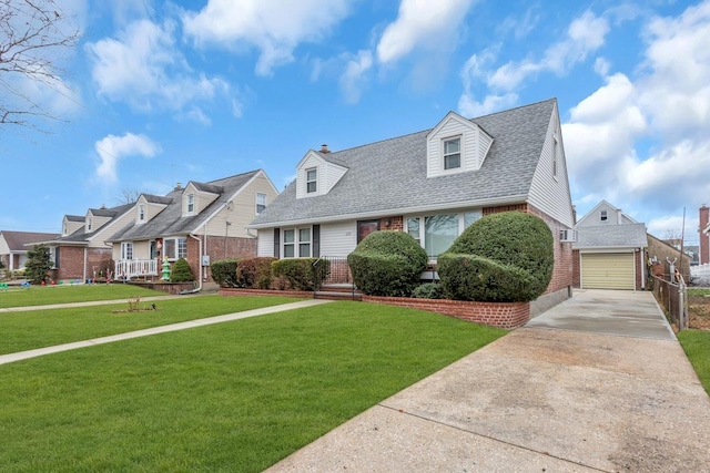 cape cod-style house with an outbuilding, a garage, and a front lawn