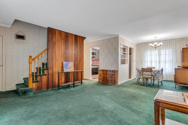 carpeted living room featuring a notable chandelier