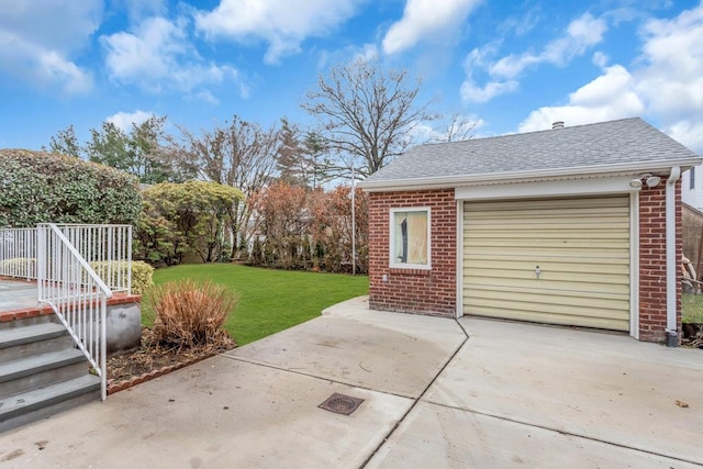 garage featuring a yard