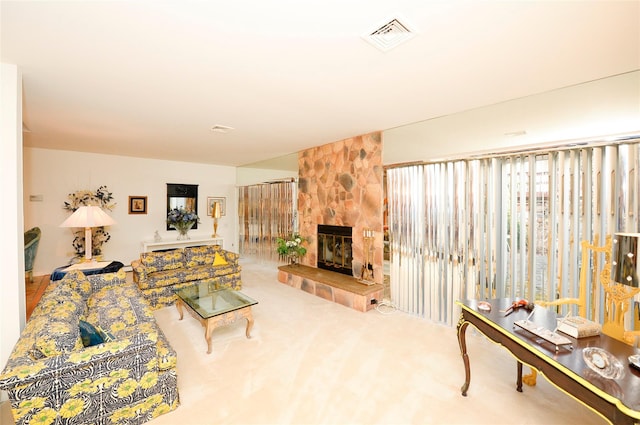 living room featuring carpet flooring and a fireplace