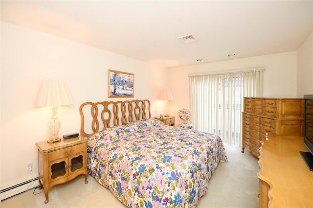 carpeted bedroom with a baseboard radiator