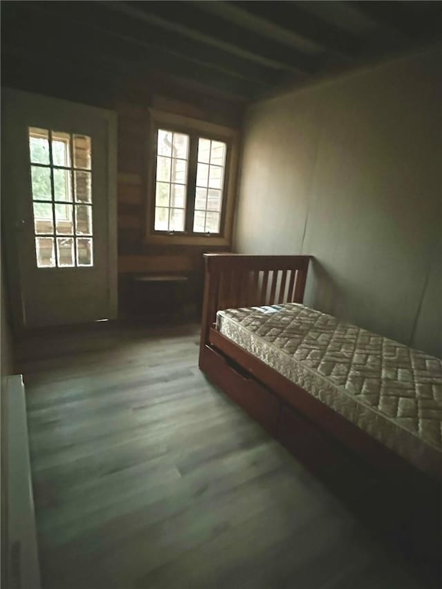 bedroom with wood-type flooring