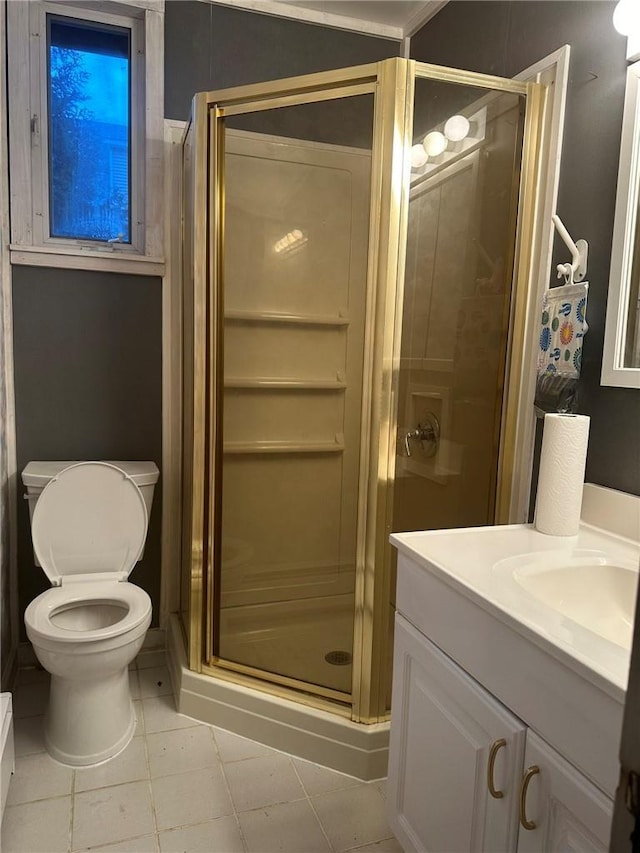 bathroom featuring tile patterned flooring, an enclosed shower, toilet, vanity, and ornamental molding