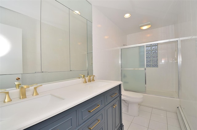 full bathroom with toilet, combined bath / shower with glass door, a baseboard radiator, tile patterned flooring, and vanity