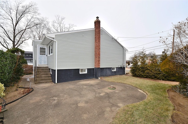 view of home's exterior with a yard