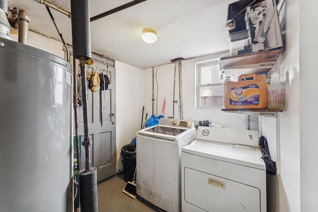 laundry room featuring washing machine and dryer and gas water heater