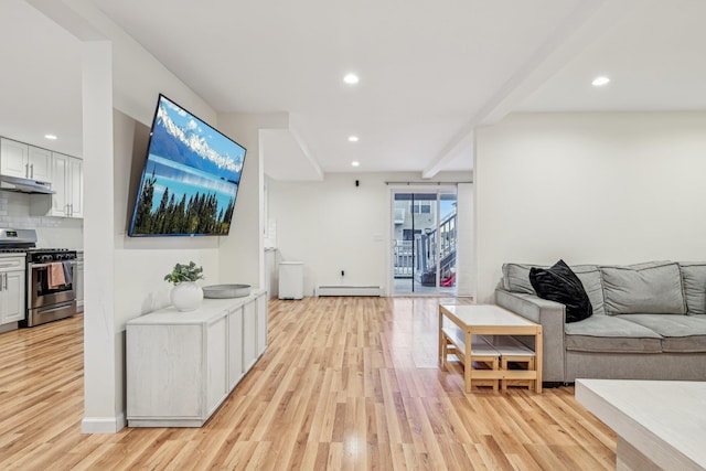 living room featuring a baseboard heating unit and light wood-type flooring