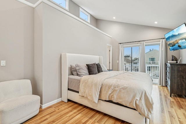 bedroom with access to outside, high vaulted ceiling, and light hardwood / wood-style flooring