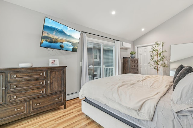 bedroom with lofted ceiling, light hardwood / wood-style flooring, baseboard heating, a wall mounted air conditioner, and access to outside