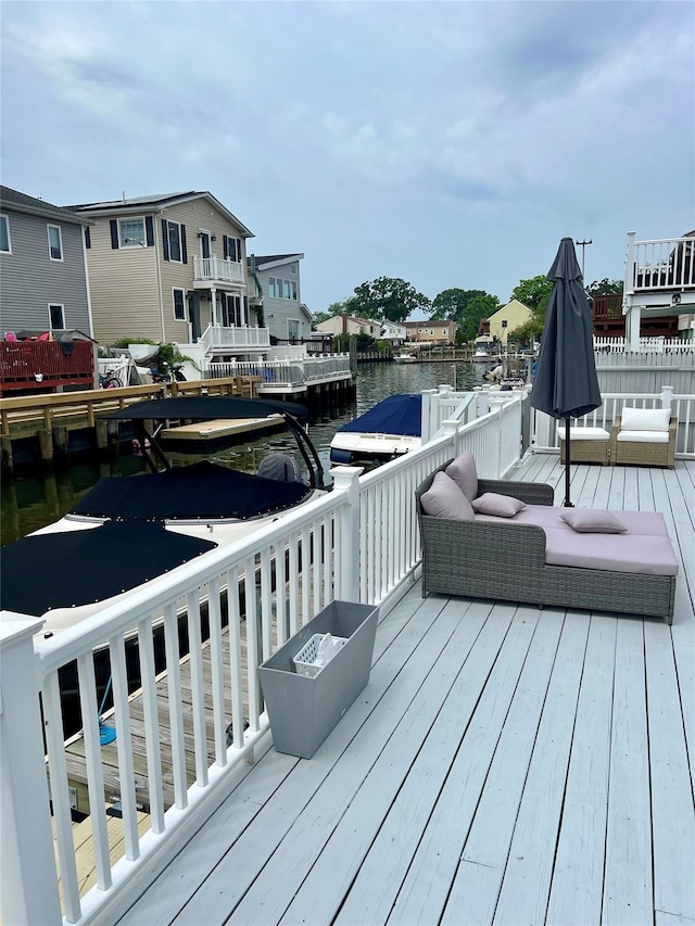 deck with a fire pit and a water view