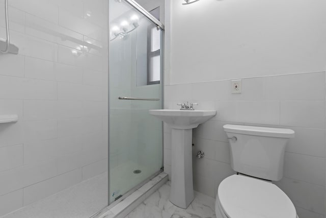 bathroom featuring toilet, walk in shower, and sink