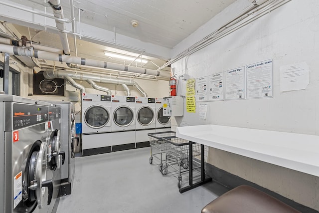 clothes washing area with washer and dryer