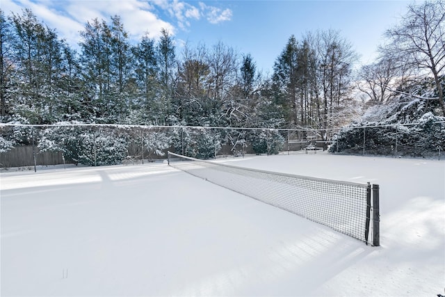 view of property's community featuring tennis court