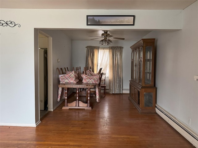 dining area with ceiling fan, dark hardwood / wood-style floors, and baseboard heating