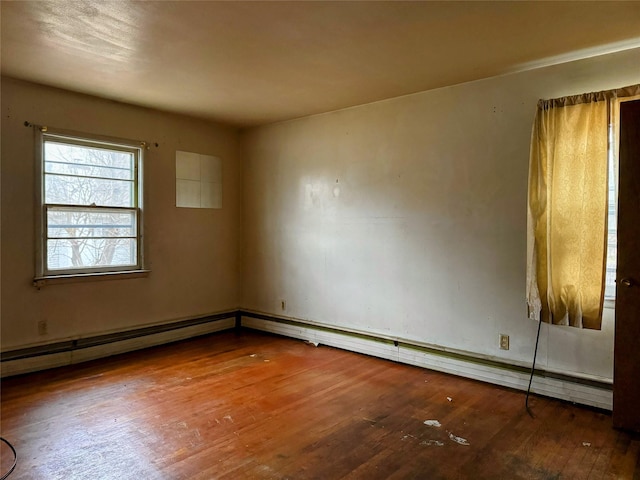 empty room featuring hardwood / wood-style flooring