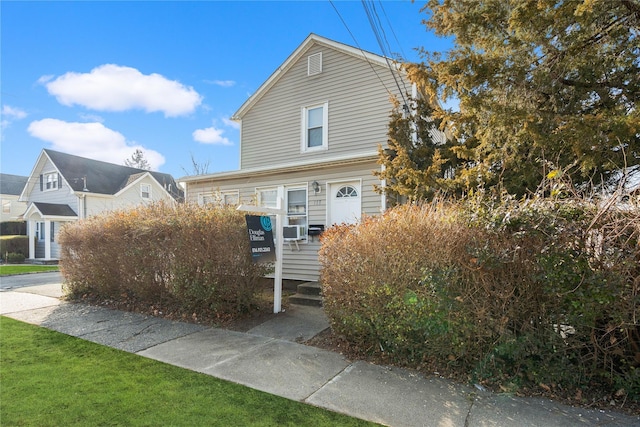 view of front of home featuring cooling unit