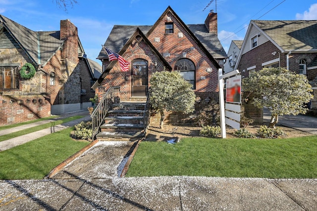 tudor house with a front lawn