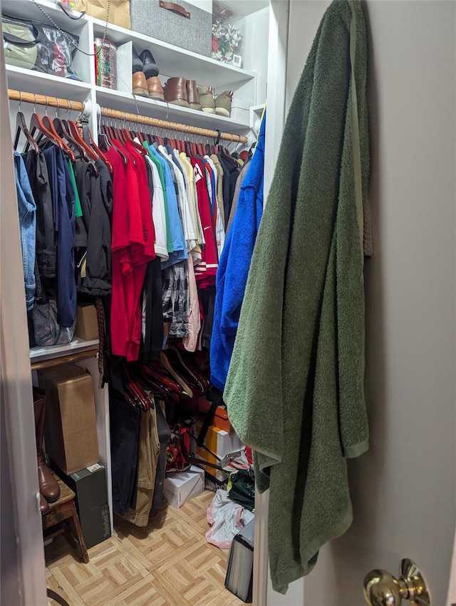 spacious closet with light parquet floors