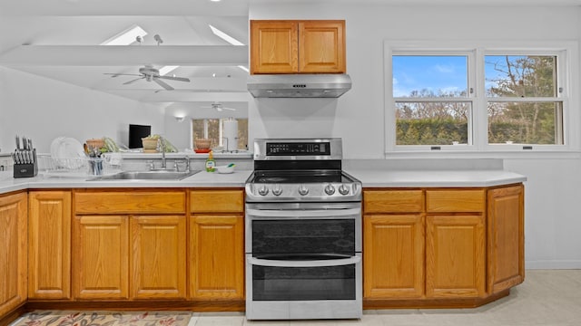 kitchen with ceiling fan, sink, and stainless steel range