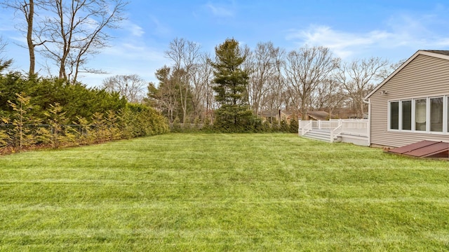 view of yard with a wooden deck