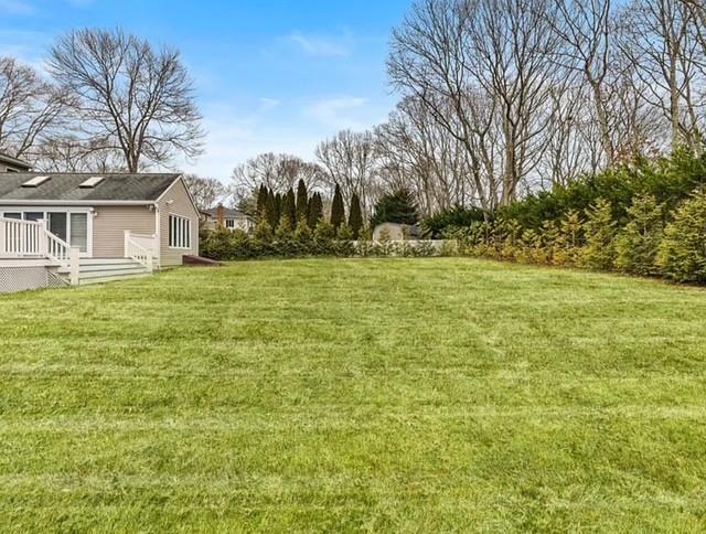 view of yard with a deck