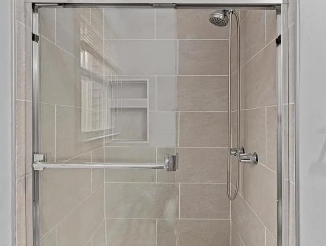 bathroom featuring a shower stall