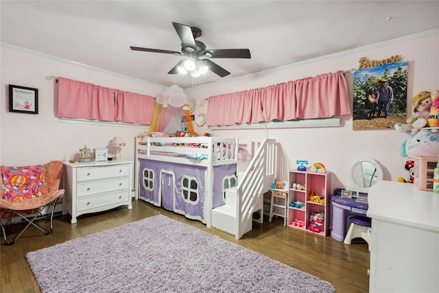 bedroom featuring crown molding, ceiling fan, and dark wood-type flooring