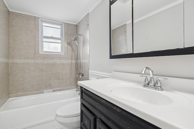 full bathroom featuring vanity, tiled shower / bath combo, ornamental molding, and toilet